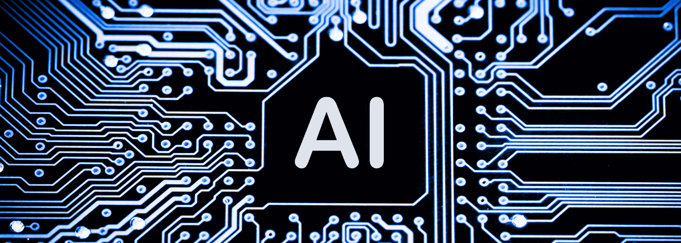 Close-up of a printed circuit board with pathways and the letters "AI" in the center indicating artificial intelligence technology.